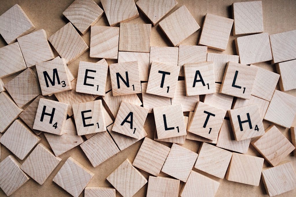 The words mental health spelled with scrabble letters