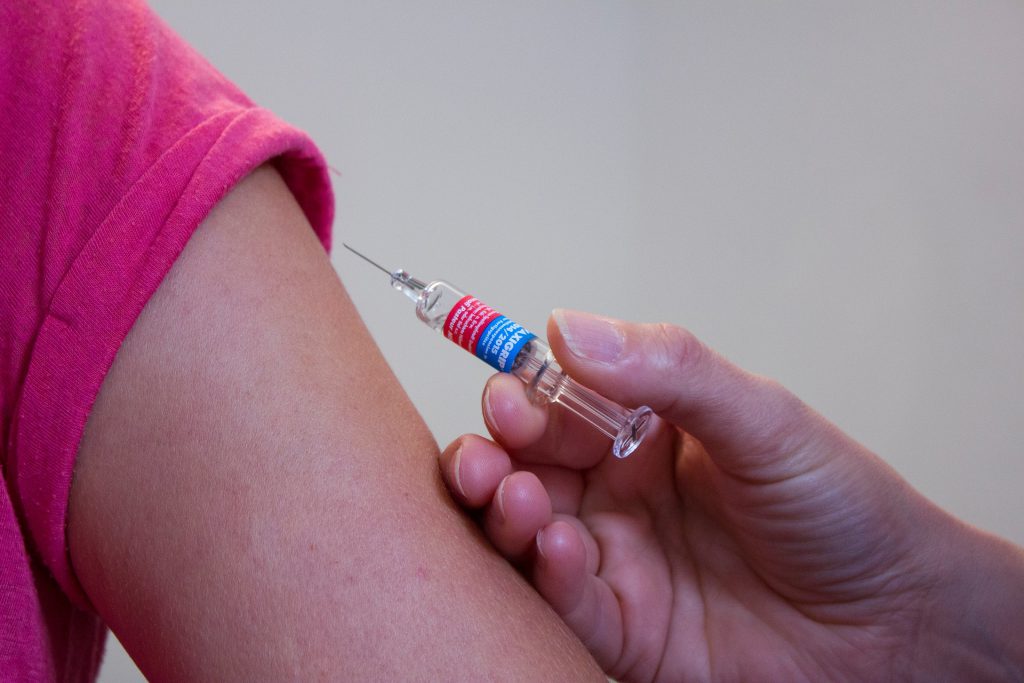 Patient receives vaccination injection