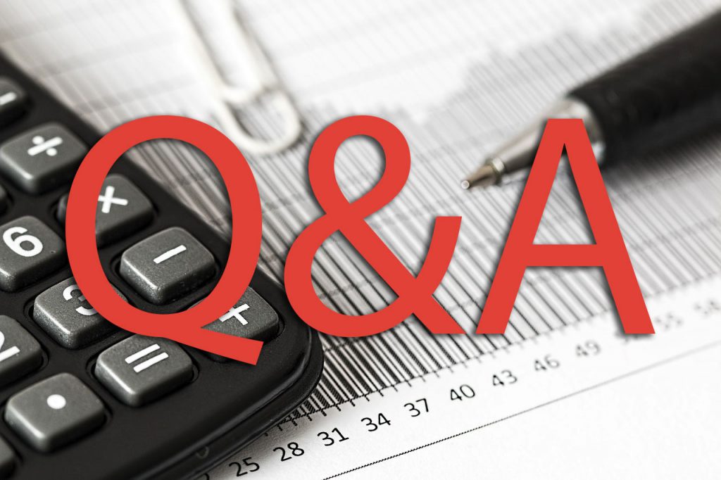 Red letters that say "Q&A" with a calculator and pen in the background.