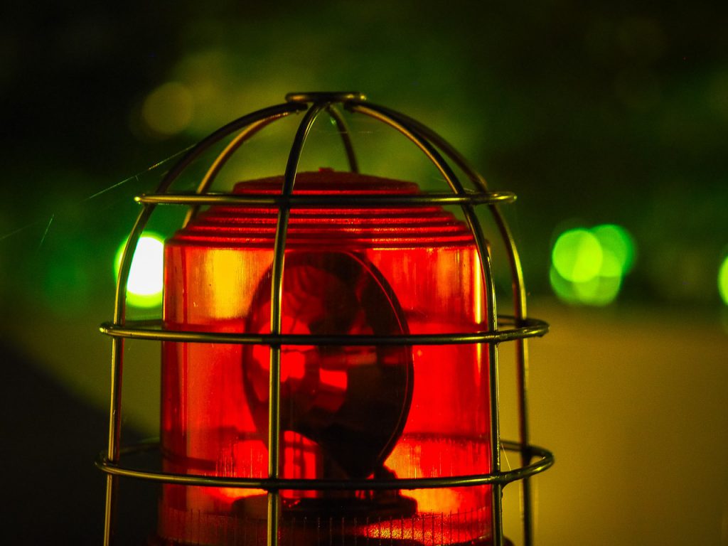 Red alarm light in cage